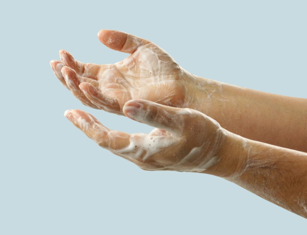 hands with soap foam